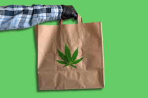 courier-holding-marijuana-delivery-bag